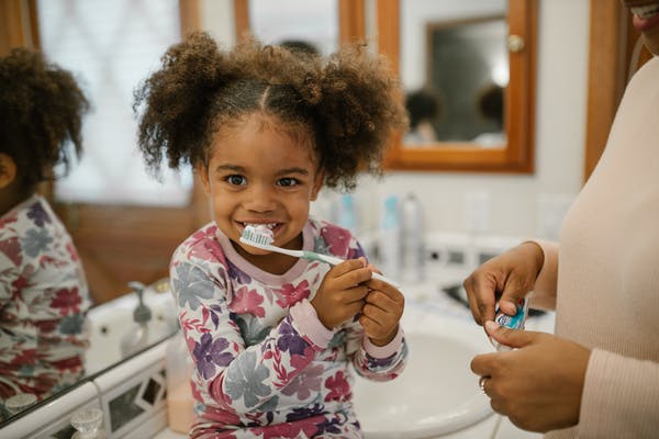 Preschool child brushing teeth